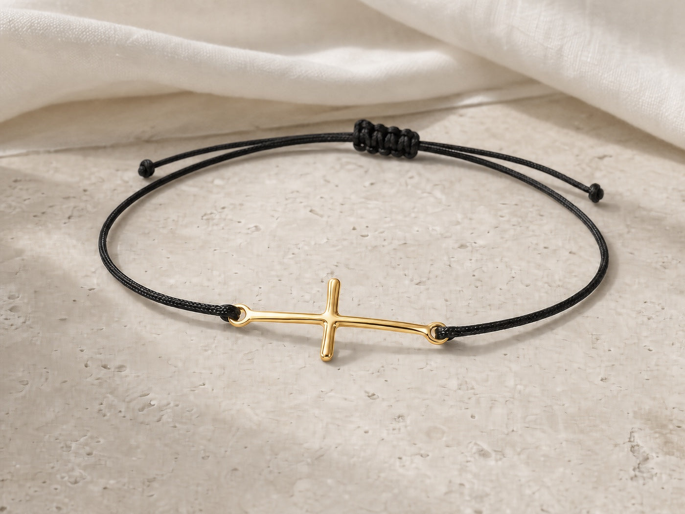 Gold cross cord bracelet