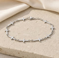 Silver linked cross bracelet