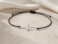 Silver cross cord bracelet